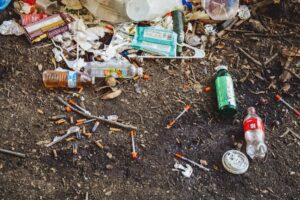 alcohol and drugs rubbish on ground